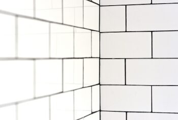 White Vintage Metro Tiles And Black Grout In A Bathroom